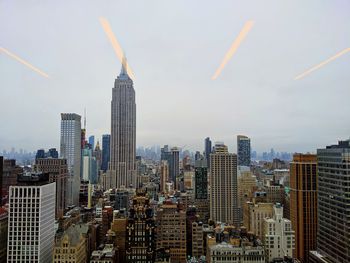 Modern buildings in city against sky