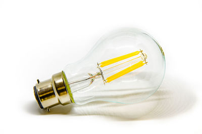 Close-up of yellow metal against white background