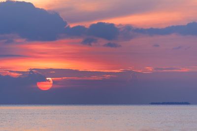 Scenic view of sea against orange sky