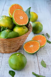 Oranges in a basket on the table