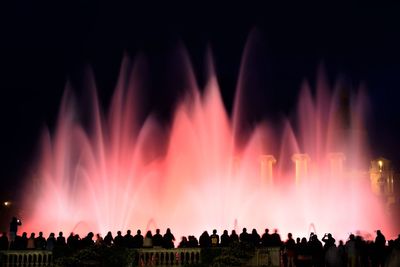 Panoramic view of crowd at night