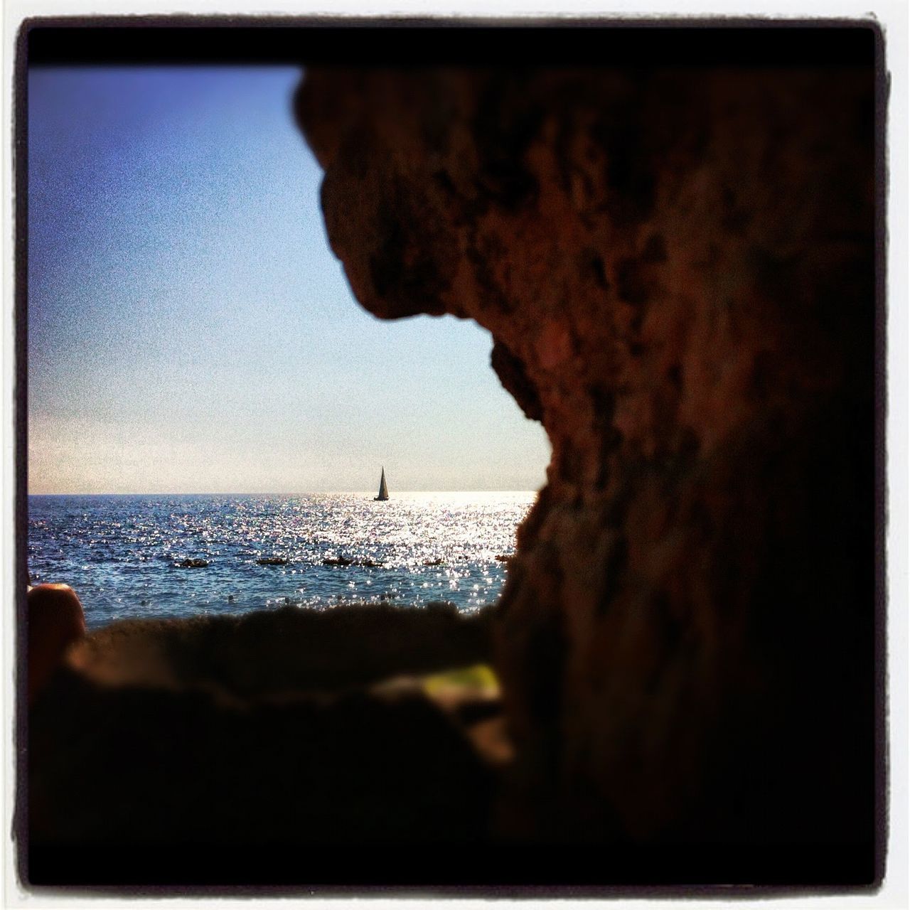 SILHOUETTE MAN BY BEACH AGAINST SKY