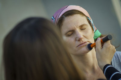 Close-up of young woman looking away