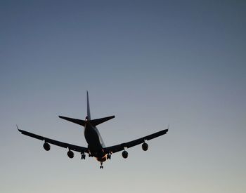 Low angle view of airplane flying in sky