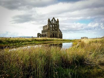 View of old ruin building in field