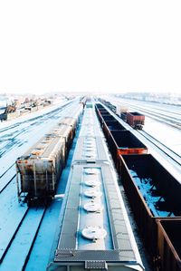 High angle view of freight train on railroad track against sky