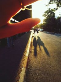 Person on road during sunset