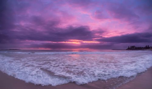 Scenic view of sea against cloudy sky