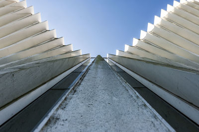 Low angle view of staircase against blue sky