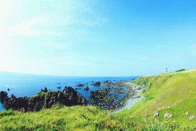 Scenic view of sea against blue sky