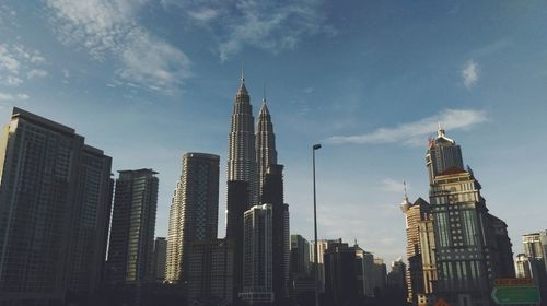 Low angle view of modern buildings against sky