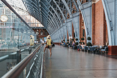 People walking on bridge in city