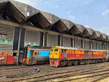 Train on railroad tracks against sky