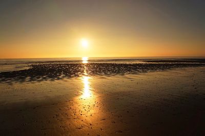 Scenic view of sea against sky at sunset