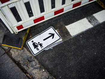 High angle view of road sign on street