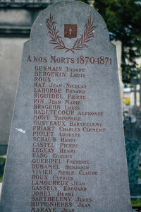 Close-up of text on stone at cemetery