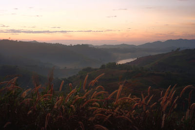 Scenic view of mountains against sky during sunset