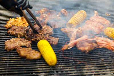 High angle view of fish on barbecue grill