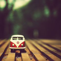 Close-up of red toy car on road