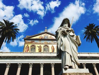 Low angle view of statue against sky