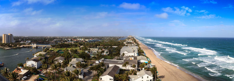 High angle view of buildings against cloudy sky