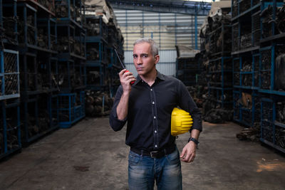 Full length of man standing in factory