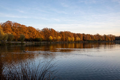 Scenic view of lake against sky during autumn