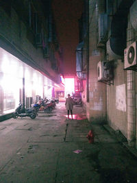 Woman standing in front of building