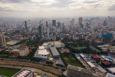 High angle view of buildings in city against sky