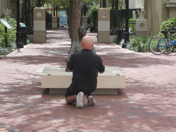 Rear view of man on street in city