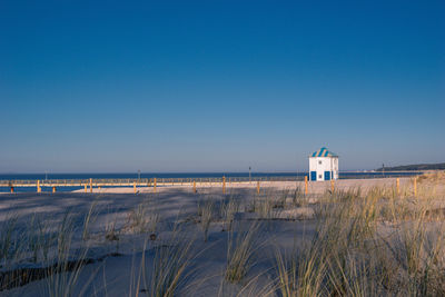 Scenic view of beach against clear sky