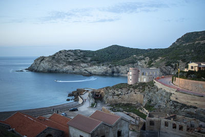 High angle view of sea and buildings against sky