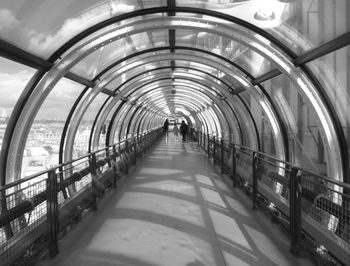 People walking on footbridge