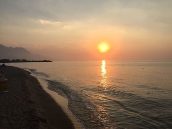 Scenic view of calm sea at sunset