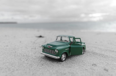 Toy car at beach