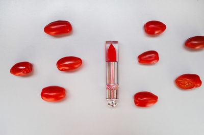 High angle view of colored pencils over white background