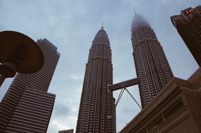 Low angle view of skyscrapers against sky