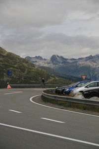 Cars on road against sky