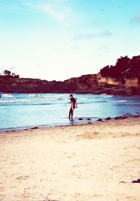 Woman standing on beach
