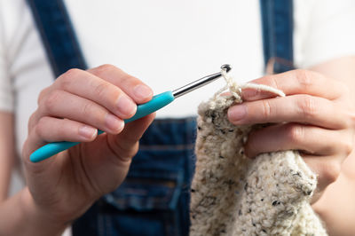 Cropped hand of woman holding dental equipment