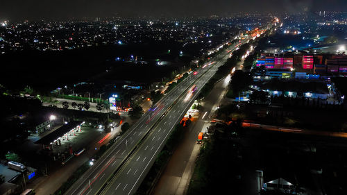 High angle view of illuminated cityscape at night