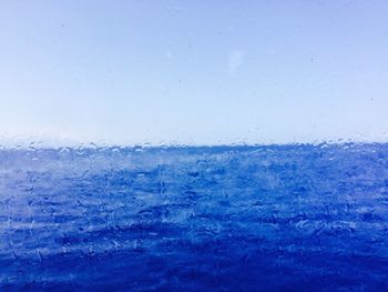 Scenic view of landscape against blue sky