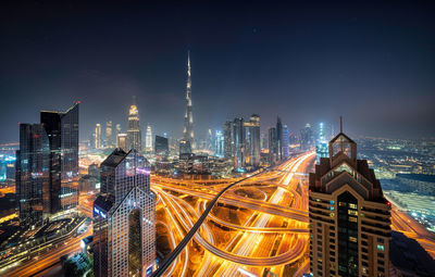 Illuminated buildings in city at night