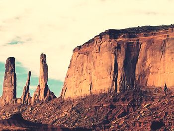 Rock formations in desert against sky