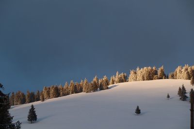 Scenic view of snowcapped landscape against clear sky