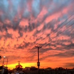 Low angle view of cloudy sky at sunset