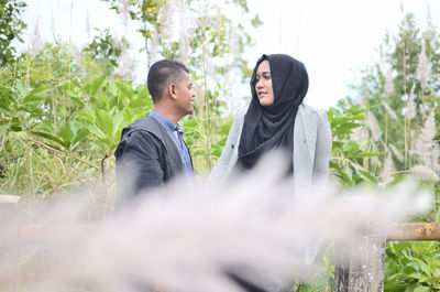 Young couple standing on land