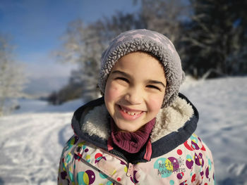 Portrait of smiling boy in snow