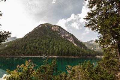 Scenic view of lake and mountains against sky