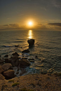 Scenic view of sea against sky during sunset